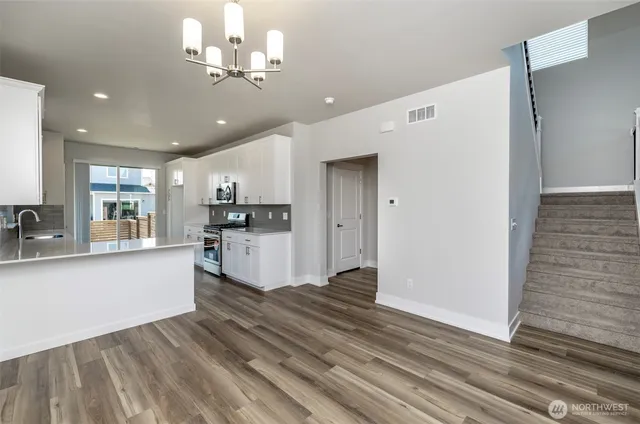 a view of kitchen with cabinets