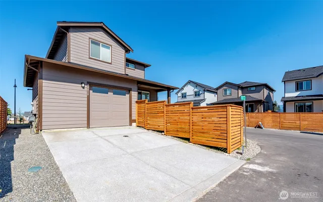 a front view of a house with a garage