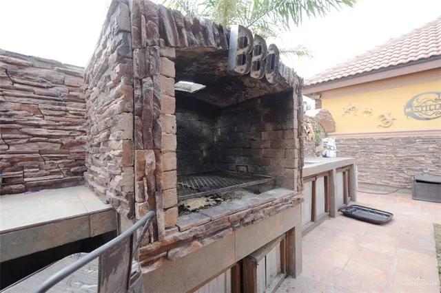 a stove top oven sitting inside of a kitchen