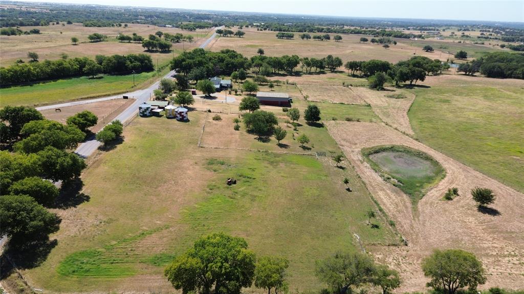 117 County Road Decatur, TX 76234 - Photo 39 of 40 Expansive acreage featuring a pond, mature trees, and a road frontage