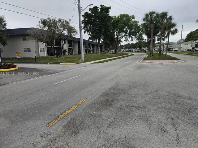 a view of road with small houses
