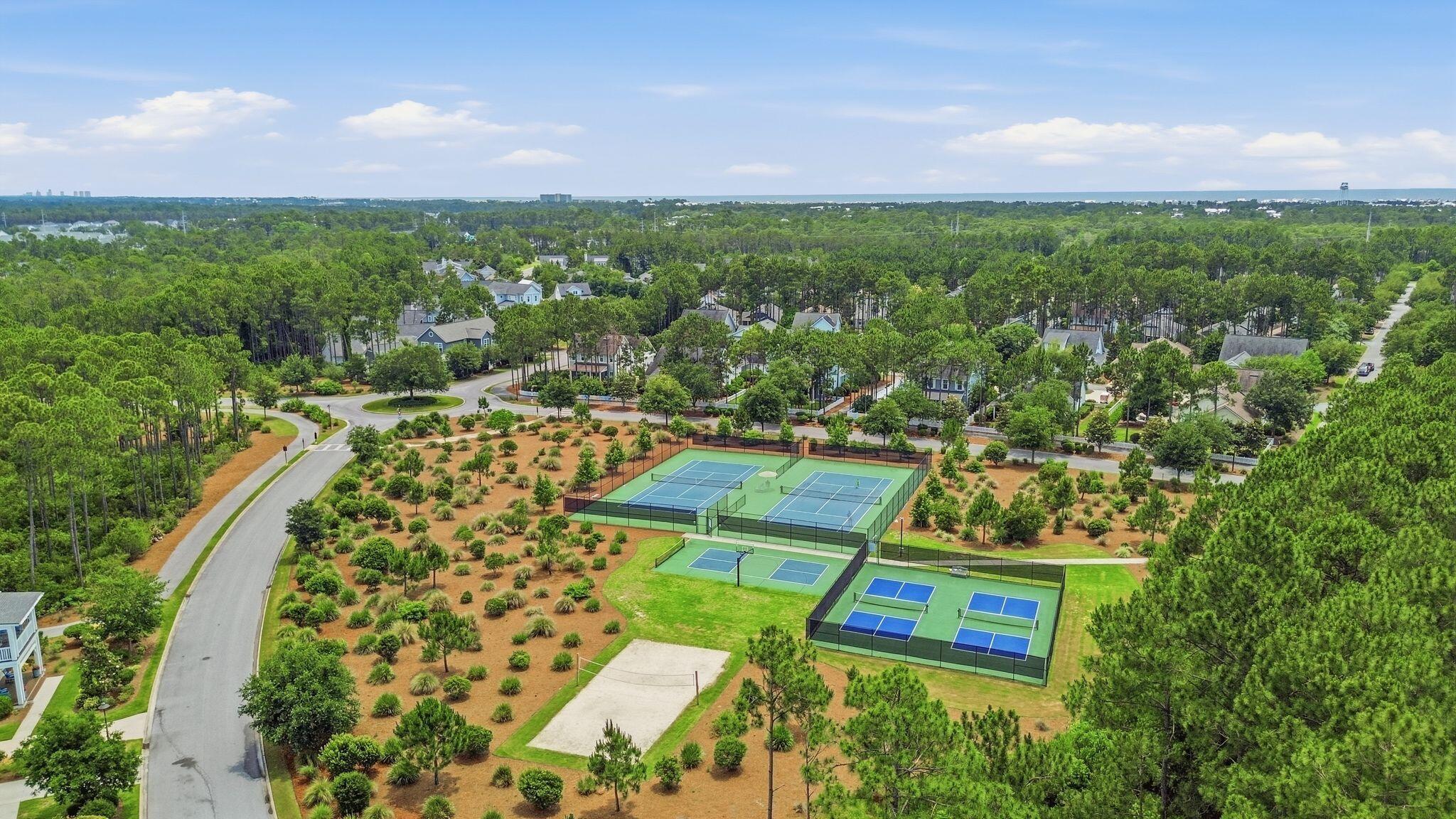 133 Sandchase Circle, Unit LOT 15 Inlet Beach, FL 32461 - Photo 40 of 47 an aerial view of a residential apartment building with a yard