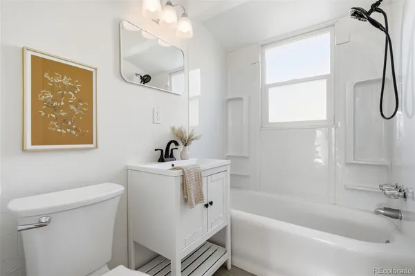 a view of washer and dryer with kitchen in the background