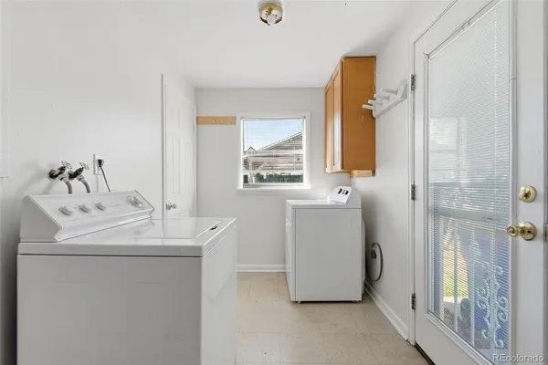 a bedroom with a bed window and wall painting