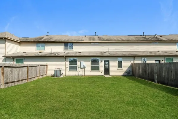 a view of a building with a yard