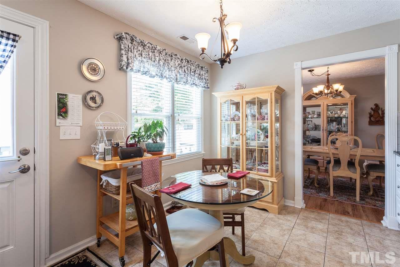 5405 Spring Pines Way Raleigh, NC 27616 - Photo 14 of 30 a view of a dining room with furniture window and outside view