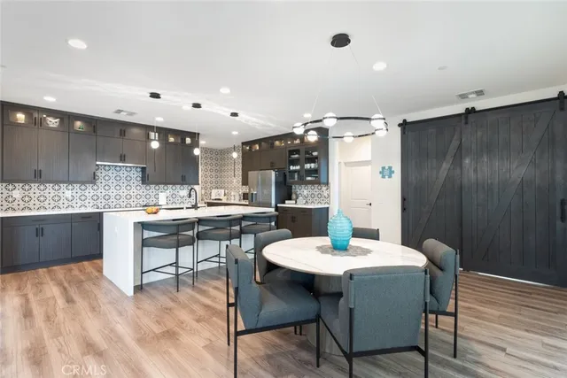 a kitchen with a table and chairs in it