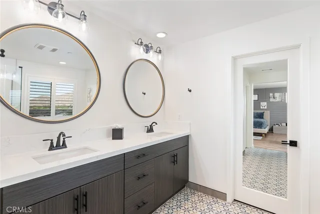 a bathroom with a sink a mirror and a shower