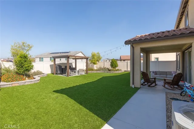 a view of a house with a garden and porch