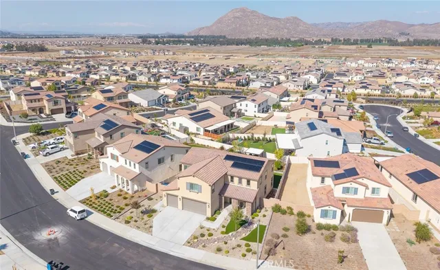 an aerial view of a house with a lake view