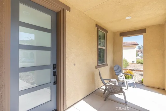 a room that has a mirror and a chair in it