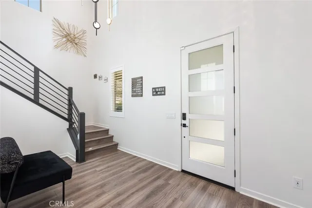 a view of entryway with wooden floor