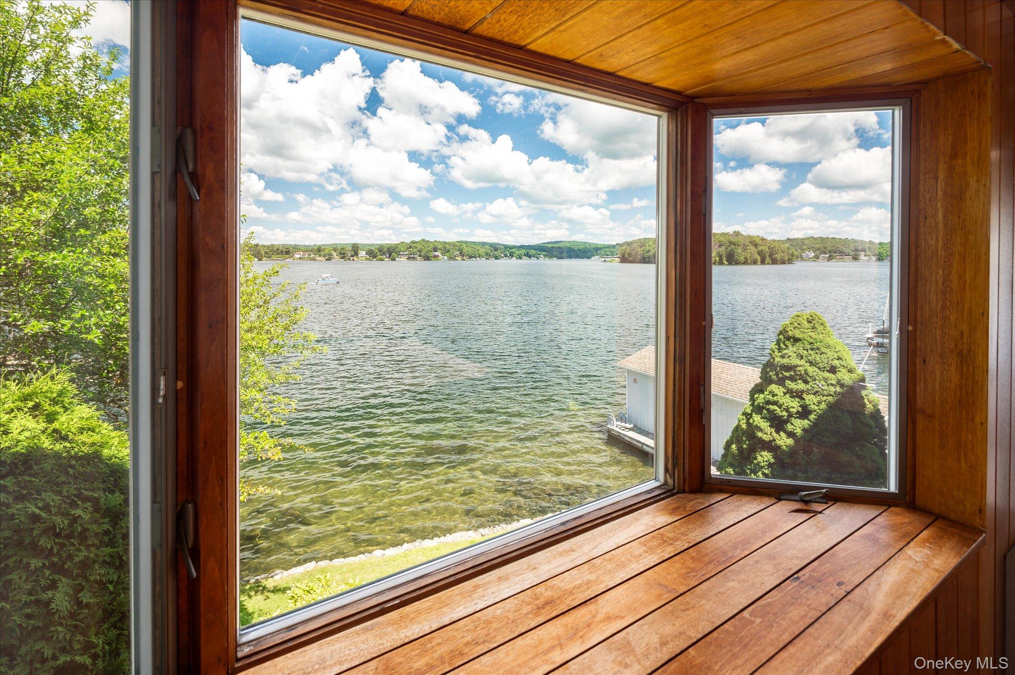 41 Tamarack Road Mahopac, NY 10541 - Photo 35 of 41 The lower level surprises with a bay window and sweeping open water views on Lake Mahopac