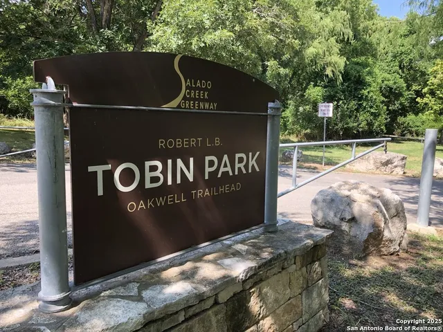 a view of outdoor space with signage and flags
