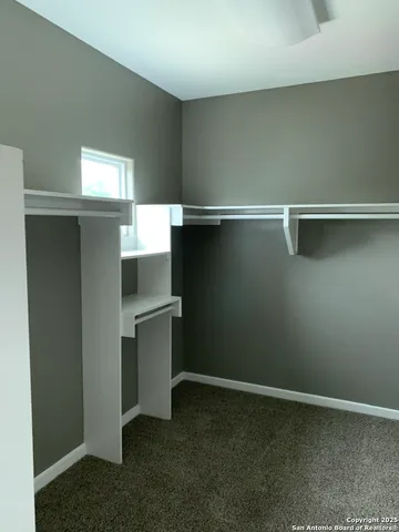 a view of an empty walk in closet