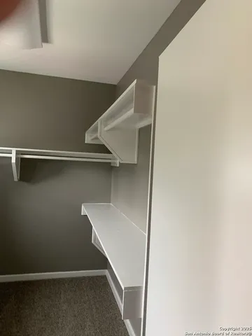 a white toilet sitting next to a shower