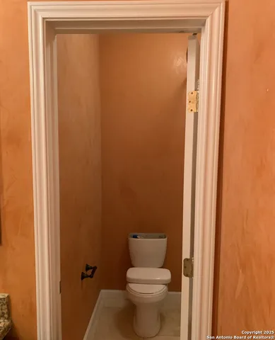 a view of a small house with backyard