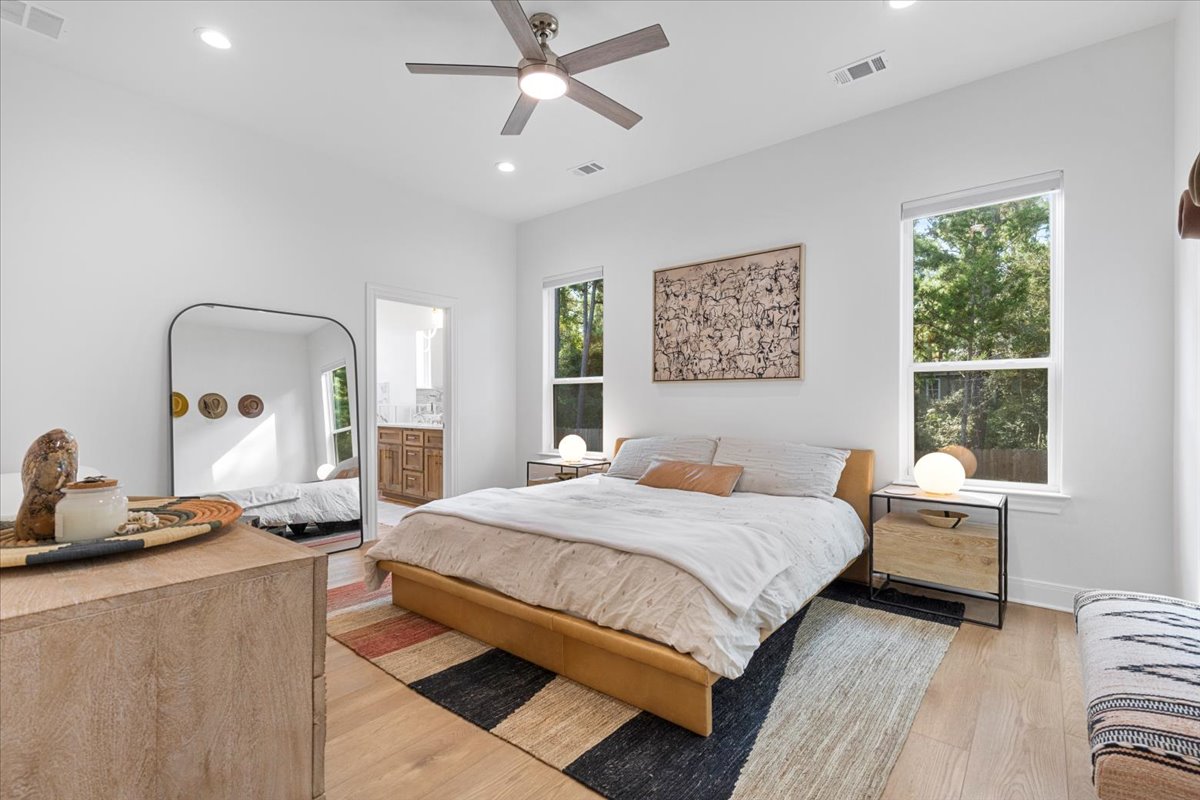133 Lake Point Way Bastrop, TX 78602 - Photo 13 of 34 a bedroom with a large bed and a window