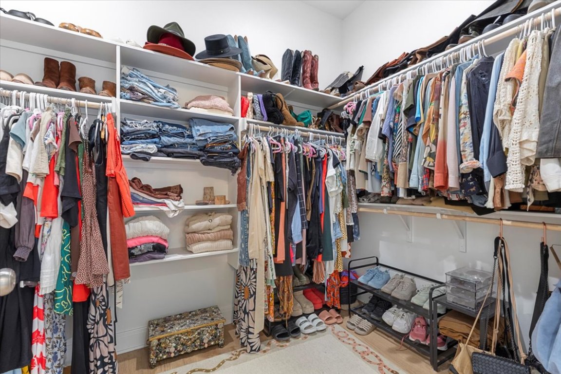 133 Lake Point Way Bastrop, TX 78602 - Photo 21 of 34 a view of walk in closet with clothes and shoes