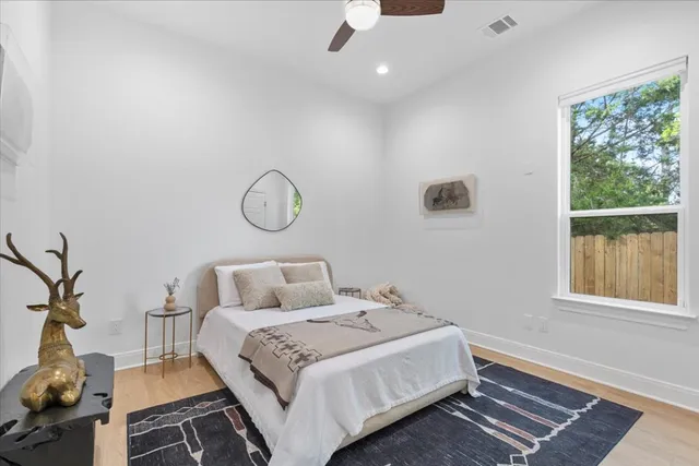 a bedroom with a bed and window