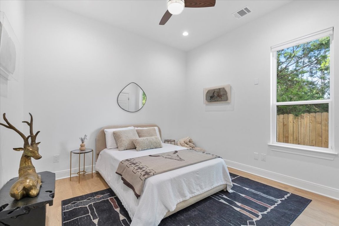 133 Lake Point Way Bastrop, TX 78602 - Photo 22 of 34 a bedroom with a bed and window