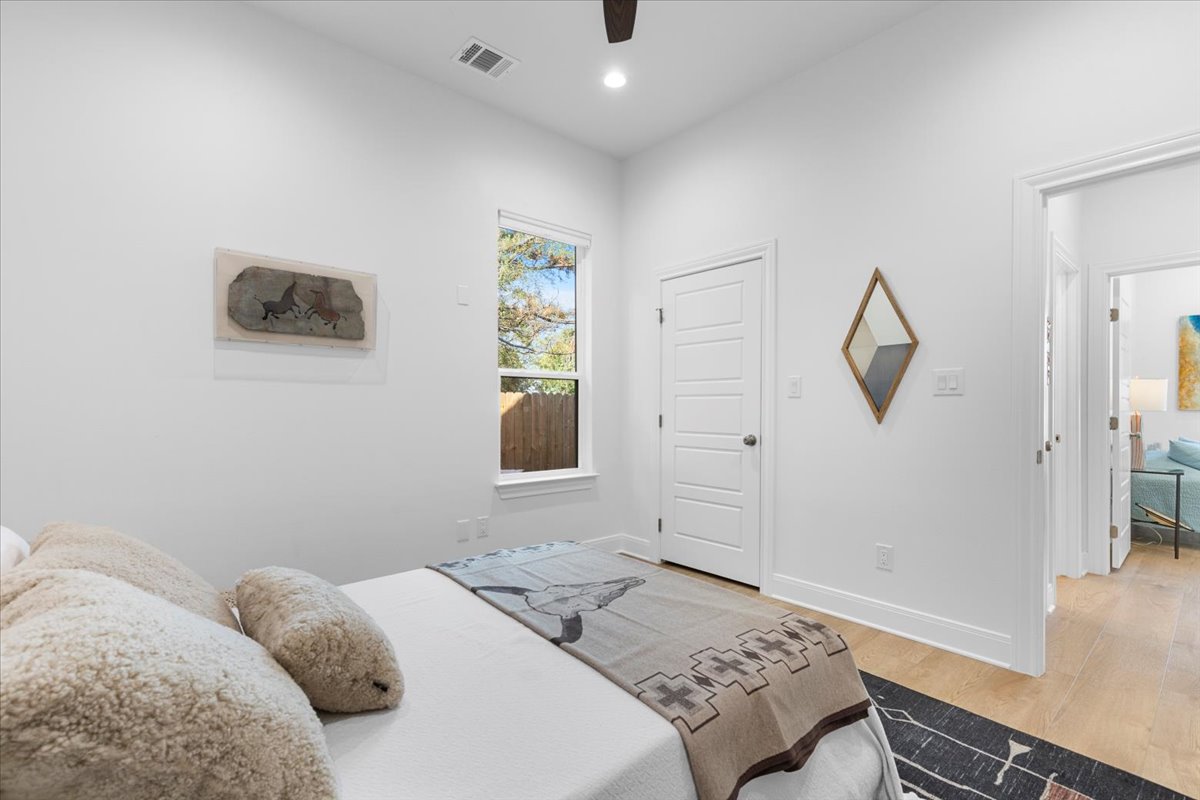 133 Lake Point Way Bastrop, TX 78602 - Photo 23 of 34 a bedroom with a bed and a window