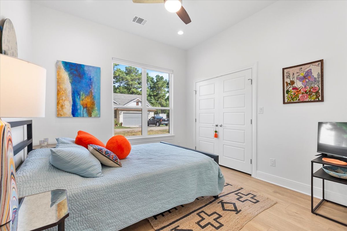 133 Lake Point Way Bastrop, TX 78602 - Photo 26 of 34 a bedroom with a large bed and a window