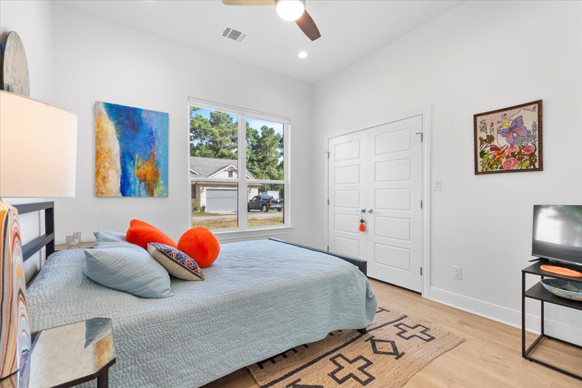 133 Lake Point Way Bastrop, TX 78602 - Photo 26 of 34 a bedroom with a large bed and a window