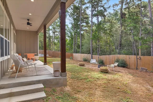 a view of backyard with a patio