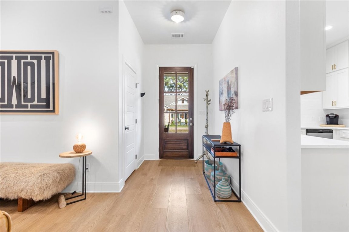 133 Lake Point Way Bastrop, TX 78602 - Photo 4 of 34 a view of a bedroom with furniture and wooden floor
