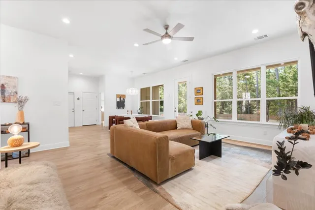 a living room with furniture and a large window