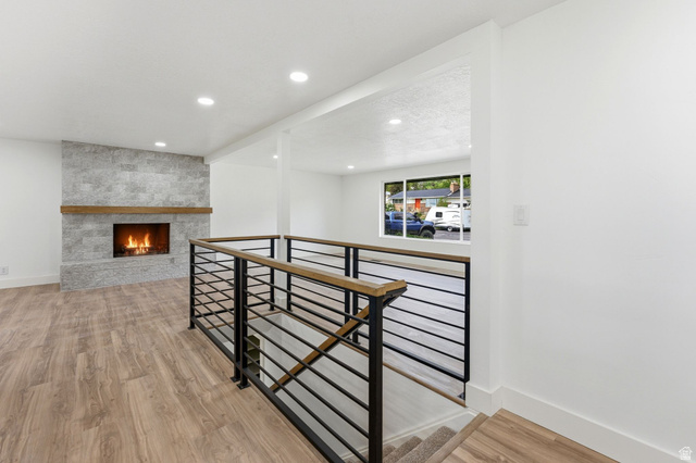 871 Bonita Way Centerville, UT 84014 - Photo 5 of 61 Modern staircase with black metal horizontal railings and a wood-finish top rail