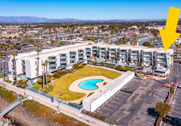 2901 Peninsula Road, Unit 351 Oxnard, CA 93035 - Photo 18 of 45 a view of a swimming pool with an ocean view