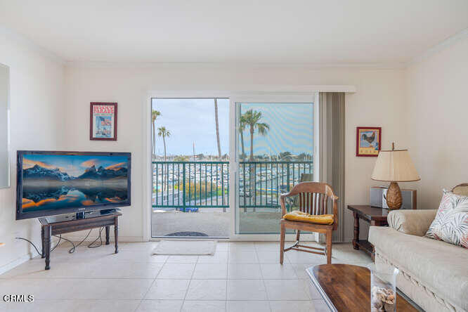 2901 Peninsula Road, Unit 351 Oxnard, CA 93035 - Photo 6 of 45 a living room with furniture and a flat screen tv