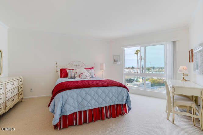2901 Peninsula Road, Unit 351 Oxnard, CA 93035 - Photo 8 of 45 a bedroom with a bed and a window