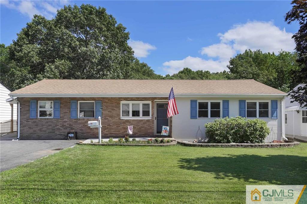 32 Brandeis Road Old Bridge, NJ 08859 - Photo 1 of 1 a front view of a house with a garden