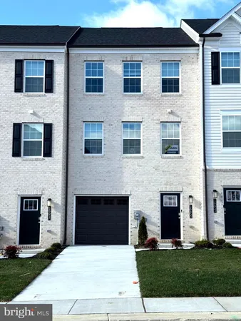 a house that has a yard in front of it