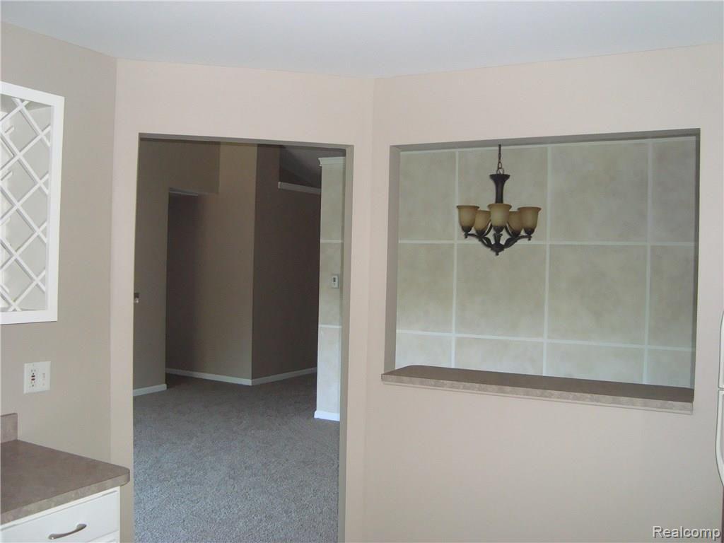 20634 Dunham Road, Unit 34 Clinton Township, MI 48038 - Photo 7 of 19 Kitchen to Living Room