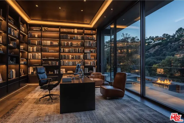 a reading room with furniture and a floor to ceiling window