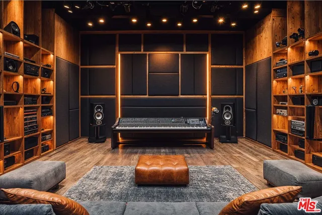 a living room with furniture a rug and stairs
