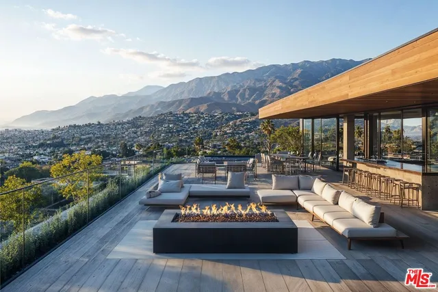 a view of a patio with couches table and chairs