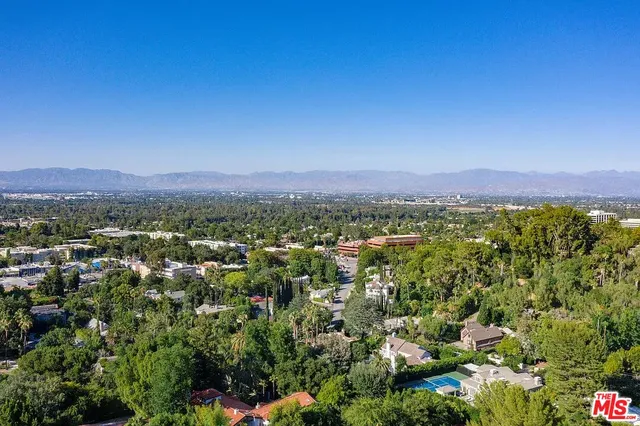 an aerial view of residential house and outdoor space