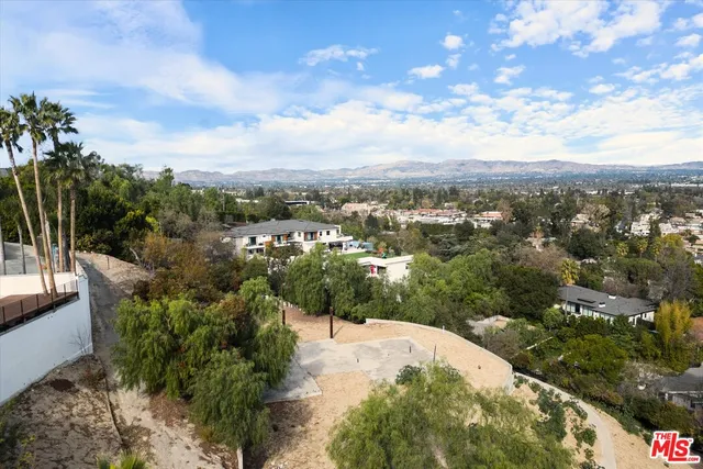an aerial view of a city with lots of residential buildings