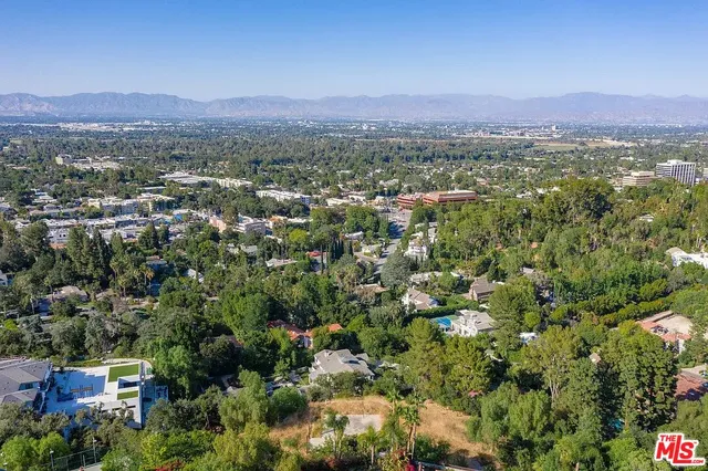 a view of a city with mountain