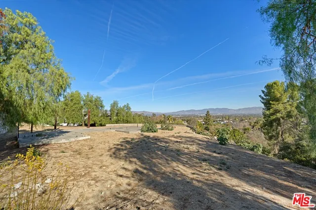 a view of beach and mountains