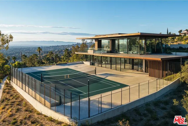 a view of a balcony with two chairs and a table