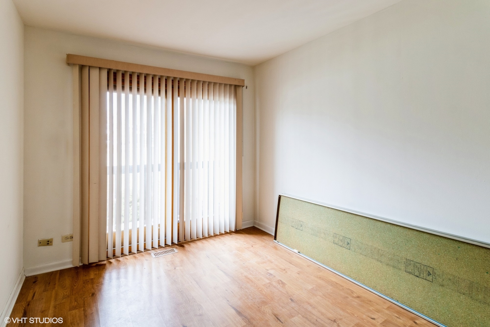 659 High Ridge Road Roselle, IL 60172 - Photo 14 of 16 an empty room with wooden floor and windows