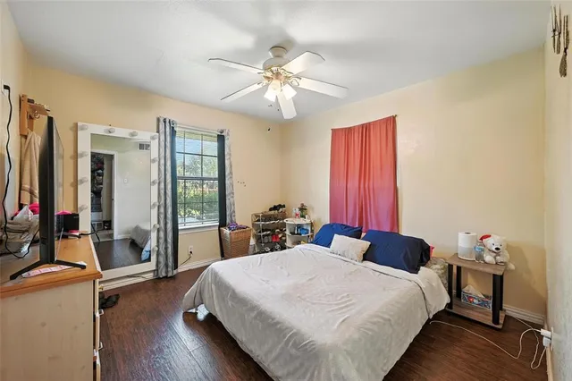 a bedroom with bed and window