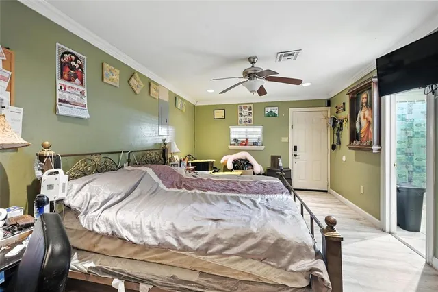 a bed room with a bed and a mirror