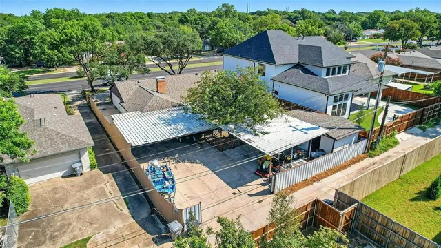 a view of a patio with table and chairs and potted plants